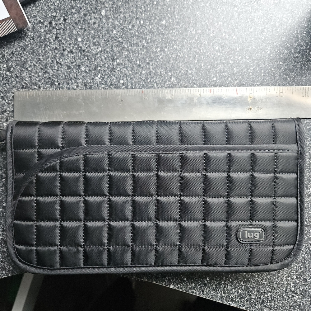 LUG black quilted passport wallet.
